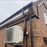 INABA DENKO SLIMDUCT Black Trunking System Installed On Brick Facade For Air Conditioner Refrigerant Pipe Routing